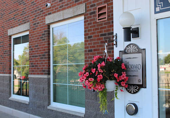 A sign on the front of Brickyard Apartments that says "Brickyard Apartments"
