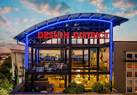 Glass lounge with neon sign that says Design District at Trend Design District, Dallas, TX 75207