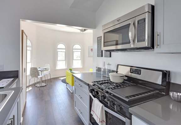 Elegant kitchen with view of light diining area.
