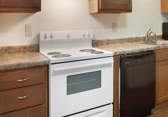Kitchen With Custom Maple Cabinetry at Cedar Park Apartments, Troy, NY, 12180