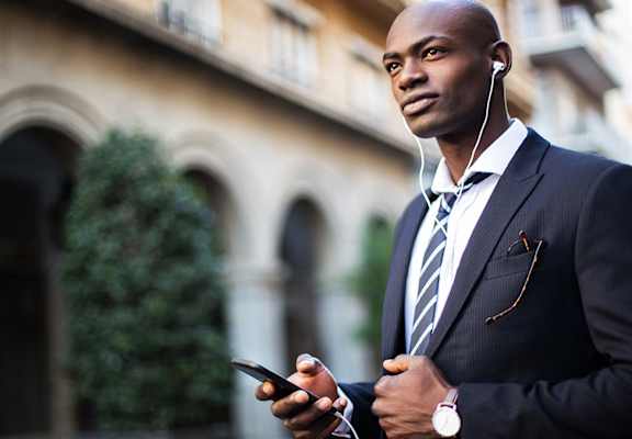 Business man listening to music