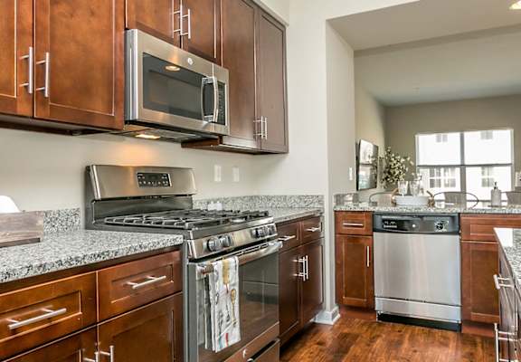Gourmet Kitchens with Islands, Caesarstone Countertops, and Decorative Backsplash at Townes at Pine Orchard, Ellicott City, 21042