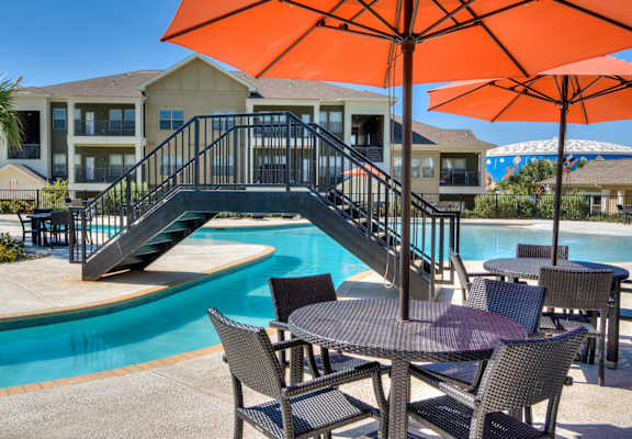 Poolside Dining Tables at La Contessa Luxury Apartments, Texas