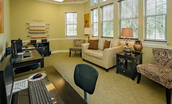 office space for residential use with desks, couches, and computers