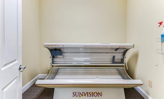 A tanning bed with the word Sunvision written on it.