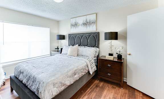 a bedroom with a bed and a dresser