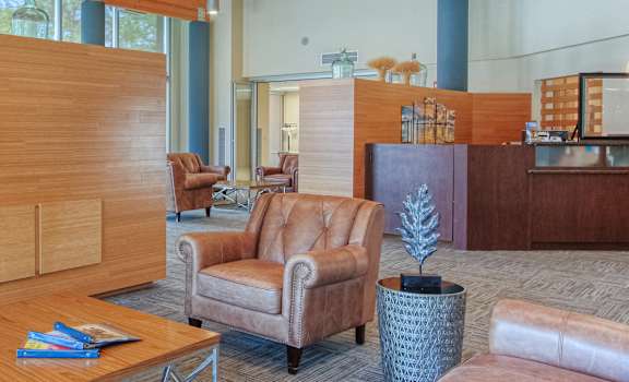 Lobby at St. Giles Manor with comfortable seating and large TV