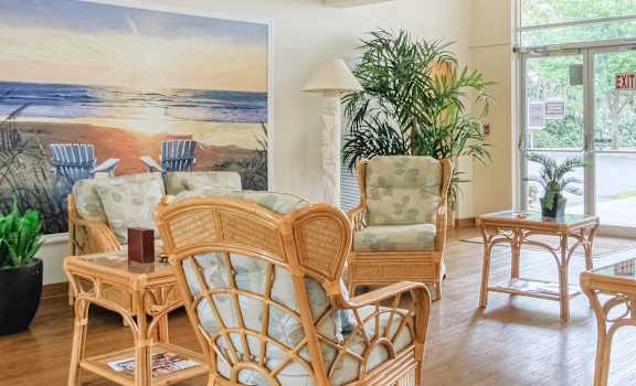 Sitting area in lobby of Villa Madonna with large windows