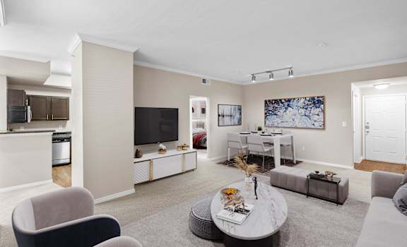 a living room with a couch and a table at The Clairborne Apartment Homes, Grand Prairie, TX, 75050