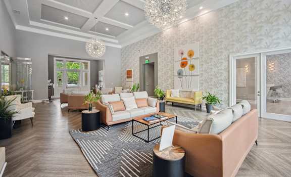 a living room with couches and a rug