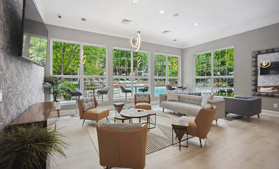 a living room with couches and chairs and a fireplace