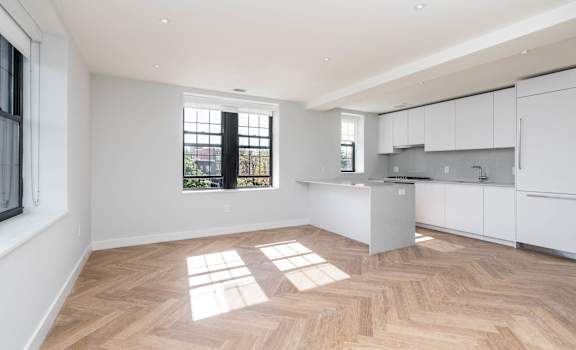 High end appliances in an open concept kitchen with great lighting
