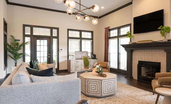 a living room with a couch and a fireplace