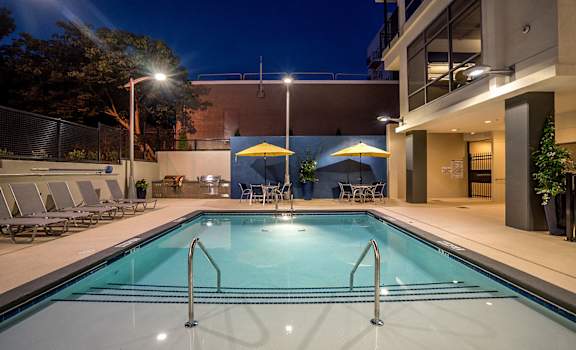 Pool View In Night at Link Apartments® Glenwood South, North Carolina, 27603