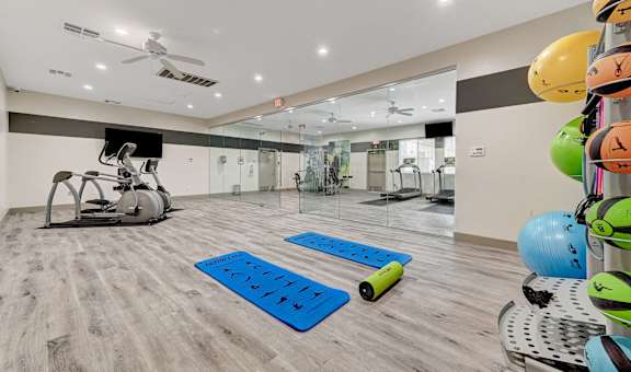 a fitness center with treadmills and other exercise equipment at The Dresden, Las Vegas, NV