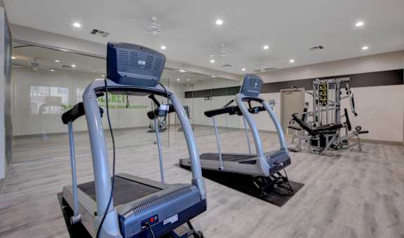 a gym with treadmills and other exercise equipment at The Dresden, Las Vegas, Nevada