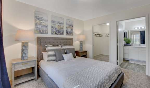 a bedroom with a bed and two night stands at The Dresden, Las Vegas, NV, 89122