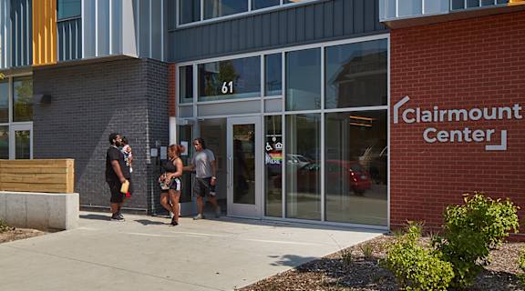 Clairmount Center building with people standing outside.