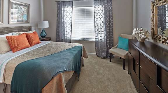 Bedroom and window at Tyler's Ridge Apartments in Carthage, NC