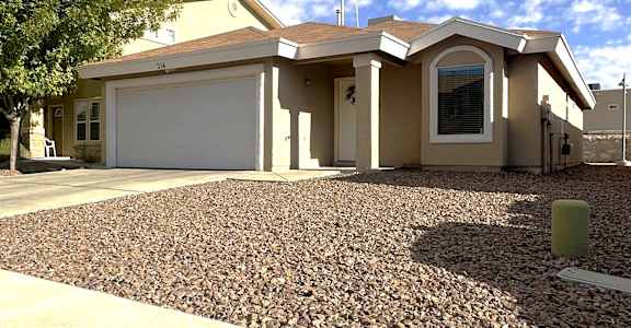 A house with a garage and a driveway.