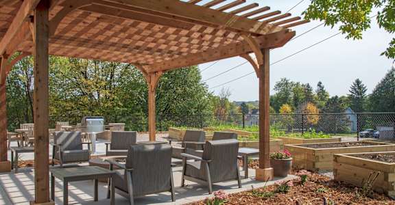 patio with firepit, seating and pergola