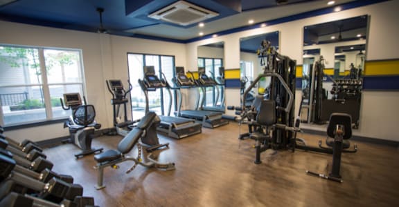 a room filled with lots of different types of exercise equipment