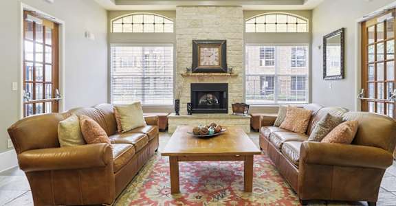 a living room with two couches and a coffee table