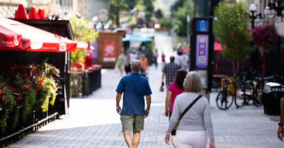 people walking down a city street