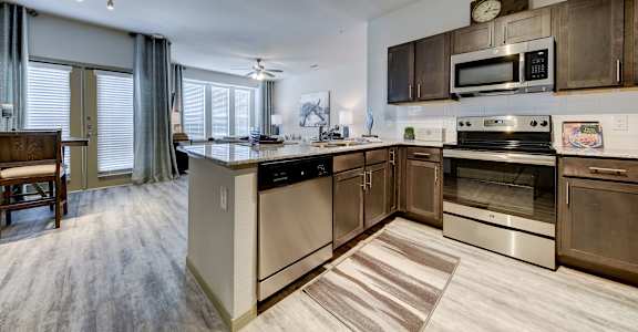 Kitchen with wooden floor at Estraya Westover Hills, San Antonio