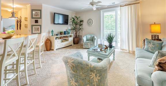 Living room with dining at River House Apartments, Norfolk, VA