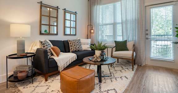 Living room with couch and table at The Mason at Fremaux Park, Louisiana