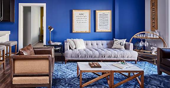 A living room with a grey couch at Waterstone at Hamburg Apartments, Lexington, KY 40509