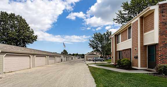 a view of a street in front of a row of houses