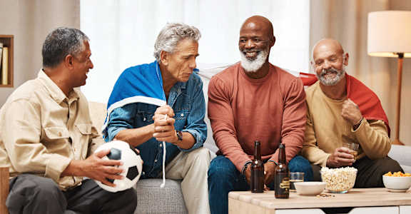 a group of men sitting in a living room talking at 55+ FountainGlen Stevenson Ranch, Stevenson Ranch, 91381