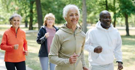 a group of people walking in the park at 55+ FountainGlen Temecula, Temecula, California