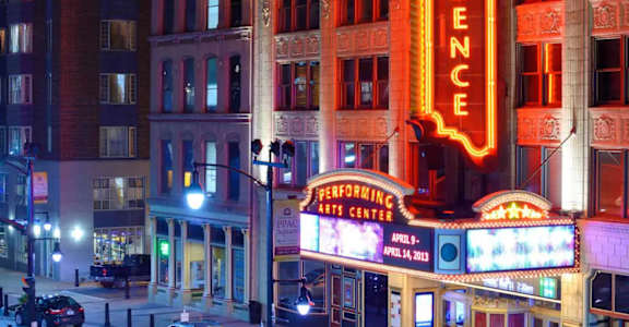 A brightly lit Providence sign is seen at night.