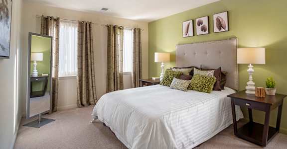 Bedroom With Expansive Windows at The Apartments at Elmwood Terrace, Frederick, MD, 21702