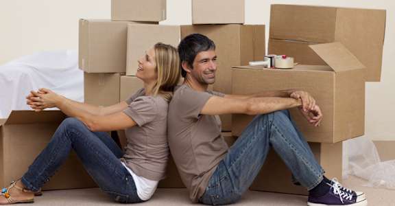 Couple with moving boxes at BLUE RAVINE SELF STORAGE, Folsom