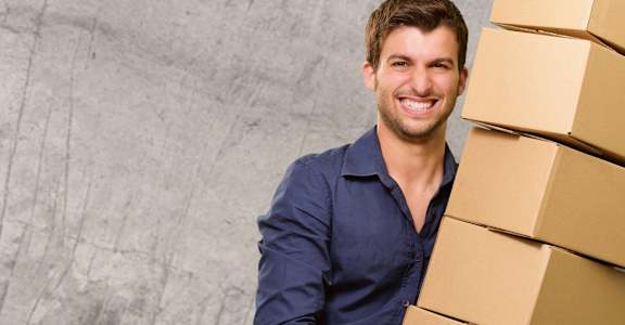 Man holding a box at BLUE RAVINE SELF STORAGE, California, 95630