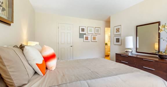 Decorated bedroom with dresser and a mirror at Annapolis Roads, Annapolis, MD