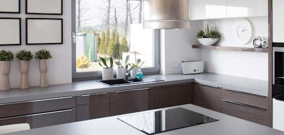 a modern kitchen with a sink and a window