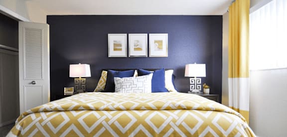 bedroom with lots of natural light and large closet