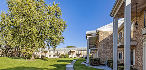 Exterior of miller west apartment with lots of green space