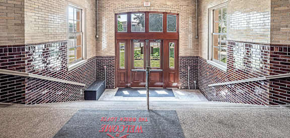 a large wooden door in a brick building