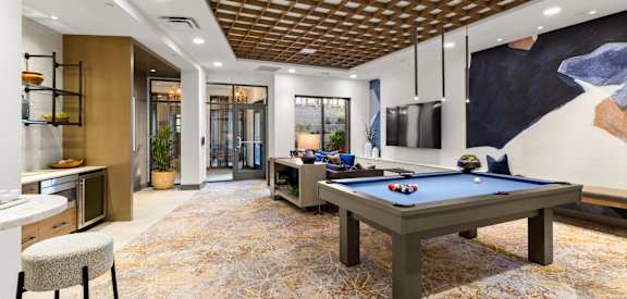 a games room with a ping pong table and a foosball table