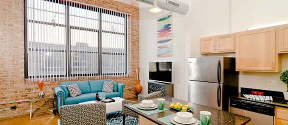 a kitchen and living room with a large window