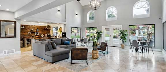 the living room is open to the dining room and kitchen