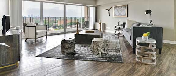 an open living room with a large window and a view of the city at CityView on Meridian, 3801 N. Meridian St, Indianapolis, IN 46208