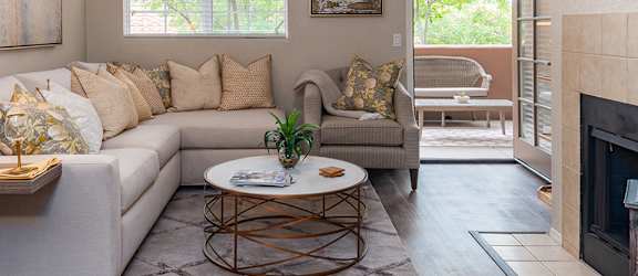 la reserve living room with cozy couches and fireplace