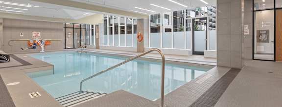 a large indoor swimming pool in a building